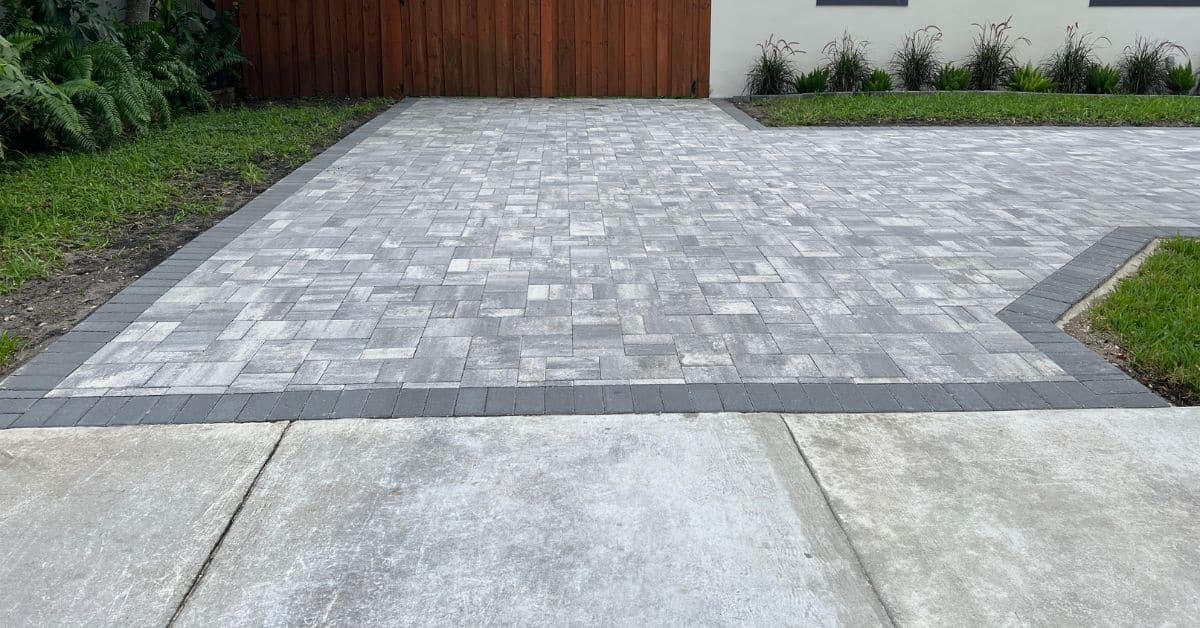 Gray paver driveway installation